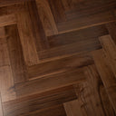 Engineered walnut parquet wood flooring with varied plank grain and seams