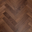 Walnut engineered wood flooring in herringbone layout, brown wood grain