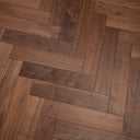 Walnut brown herringbone engineered flooring with visible knots and grain