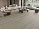 Light gray oak-look SPC flooring with woodgrain texture on a room floor