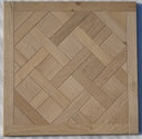 Light oak parquet wood panel with diamond herringbone pattern, matt lacquer finish