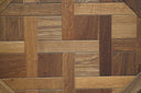 Smoked wood Versailles parquet panel close-up, rectangular wood strip pattern