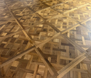 Smoked brushed wood Versailles parquet panel with light and dark interlocking block pattern