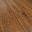 Engineered oak flooring planks close-up, warm brown with linear wood-grain texture