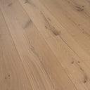Light oak engineered wood planks with natural grain lines and small knots
