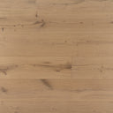 Light oak engineered wood plank flooring close-up with natural grain and knots