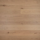 Light oak-toned wood plank flooring with matte finish and visible grain