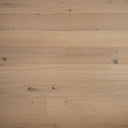 Light oak SPC hybrid click flooring planks with brushed grain and visible plank seams