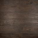 Distressed black engineered wood flooring—dark plank close-up with grain lines