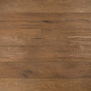 Engineered wood flooring in distressed golden light brown, plank pattern close-up