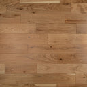 Engineered oak-toned wood flooring planks with staggered rectangular pattern