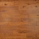 Golden hand-scraped engineered wood flooring with long rectangular plank boards.