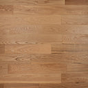 Engineered wood flooring planks in warm light brown with visible grain and staggered layout
