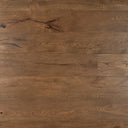 Distressed engineered wood flooring in light brown with visible plank seams and knots
