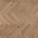 Unfinished engineered herringbone wood flooring in light wood tone, close-up texture