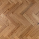 Brushed oiled engineered wood herringbone flooring in a light natural oak tone.