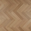 Engineered herringbone wood flooring, light oak tone with staggered rectangular planks.