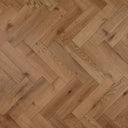 Brushed UV-oiled engineered wood herringbone floor in light brown with visible knots