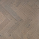 Engineered herringbone flooring pattern view, light grey oak-style plank boards