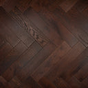 Engineered herringbone wood flooring in dark walnut with brushed lacquer and varied grain
