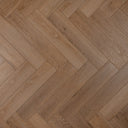 Honey oak herringbone floor with rectangular plank pattern and knots