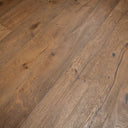 Warm brown engineered wood flooring planks with pronounced natural grain and knots