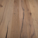 Antique distressed engineered wood flooring with long warm brown planks and dark knots