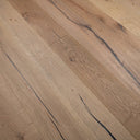 Antique distressed engineered wood flooring close-up, light brown planks with blue distress