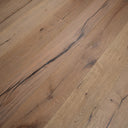 Antique distressed engineered wood flooring with warm brown boards and pronounced blue-gray streaks
