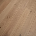 Light wood plank flooring with matte look and subtle knot details