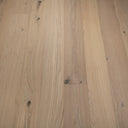 Light oak SPC flooring planks with brushed woodgrain, knots, and click-lock seam lines