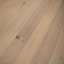 Light oak SPC flooring planks with brushed grain, knots, and staggered seam pattern