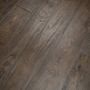 Distressed black engineered wood flooring—long dark planks with distressed texture