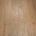 Distressed engineered wood plank flooring in a straight-board layout