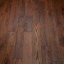 Medium-dark brown engineered wood flooring planks, straight rows with varied grain