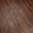 Warm brown engineered wood flooring planks with detailed knot and swirling grain