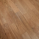 Warm light brown engineered wood flooring with straight boards and clear swirling grain