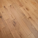Natural oak engineered wood flooring showing brushed lacquered plank texture and seams