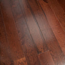 Walnut stained engineered wood flooring planks with dark grain lines, close-up