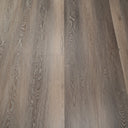 Ash brown SPC vinyl plank flooring, staggered seams and wood-grain texture