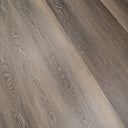 Ash brown SPC vinyl plank flooring detail with swirling wood-grain lines