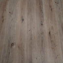 Gray wood-grain SPC vinyl flooring planks with knots, close-up texture