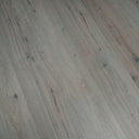 Clay grey SPC vinyl flooring showing diagonal wood-grain knots and streaks