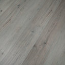 Clay grey SPC vinyl flooring with wide plank look and visible wood-grain swirls