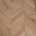 Light oak chevron pattern engineered wood planks with matte, lightly brushed surface