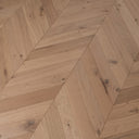 Light oak chevron engineered wood flooring with matte finish and natural grain