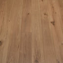 Engineered brushed lac wood flooring with vertical plank lines, light tan finish
