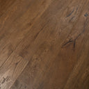 Distressed light brown engineered wood planks with varied grain, knots, and plank edges
