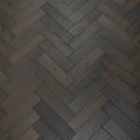 Graphite grey engineered herringbone wood flooring with brushed matte texture