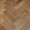 Smoked engineered herringbone wood flooring, mixed light and dark brown boards